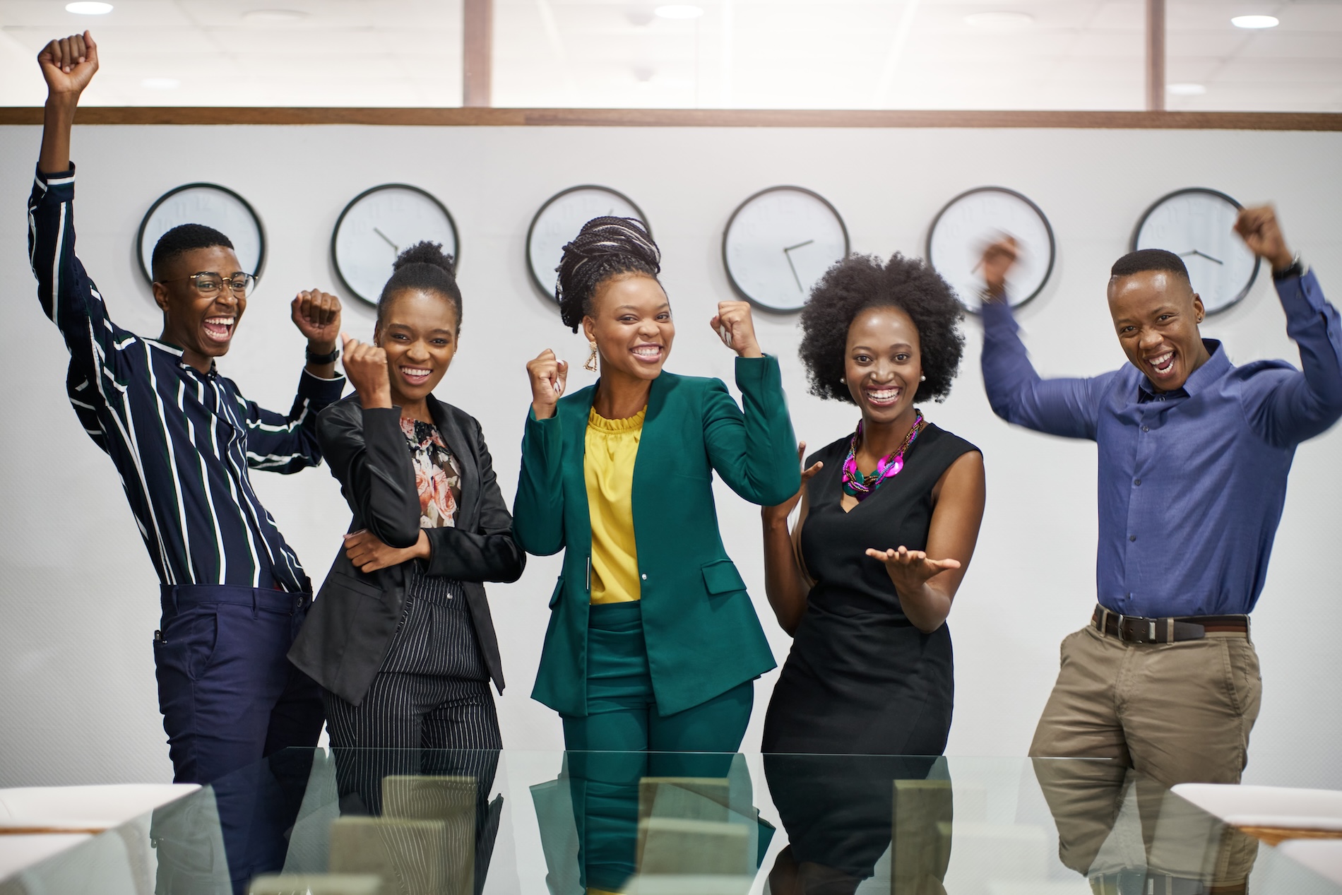 A diverse team gathered in a safe, supportive workplace